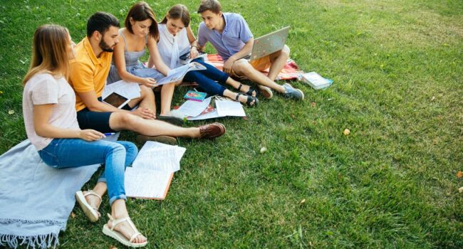 https://www.freepik.com/free-photo/group-of-cheerful-students-teenagers-in-casual-outfits-with-note-books-and-laptop_2583684.htm